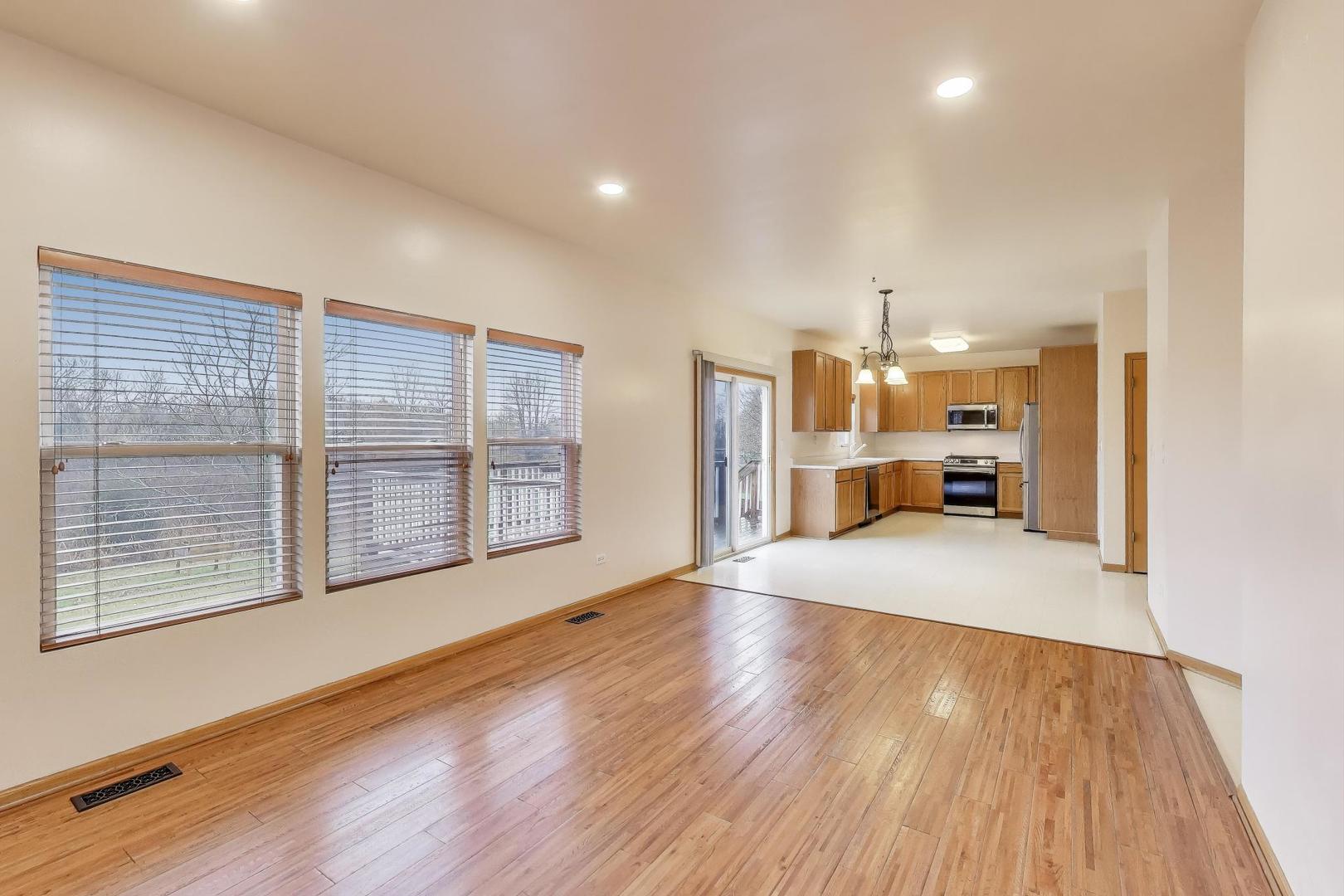 719 Sun Lake Road Lake Villa, IL 60046 - Photo 18 of 46 a view of empty room with wooden floor and a window