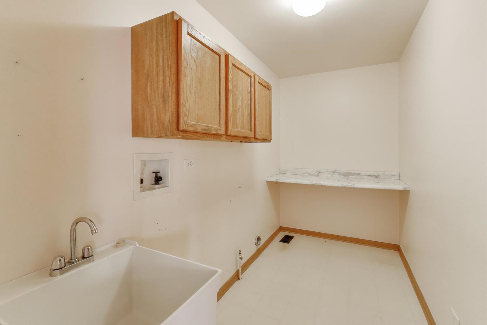 719 Sun Lake Road Lake Villa, IL 60046 - Photo 20 of 46 a bathroom with a sink and a mirror