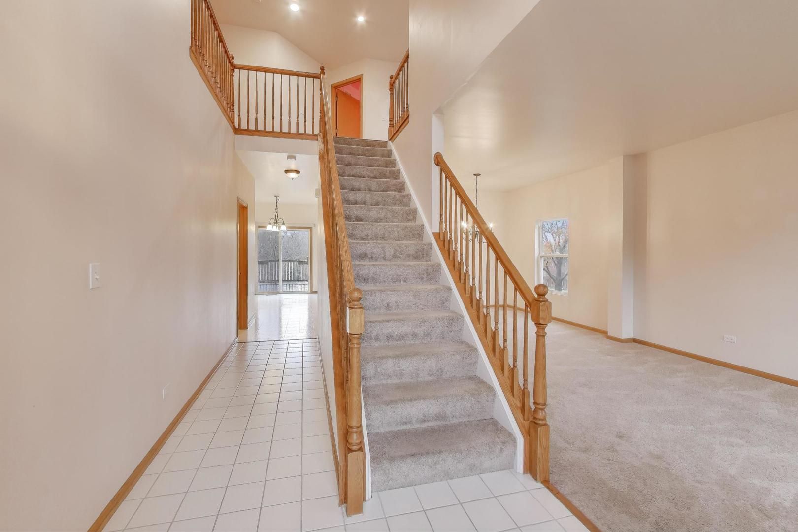 719 Sun Lake Road Lake Villa, IL 60046 - Photo 2 of 46 a view of entryway and hall with wooden floor