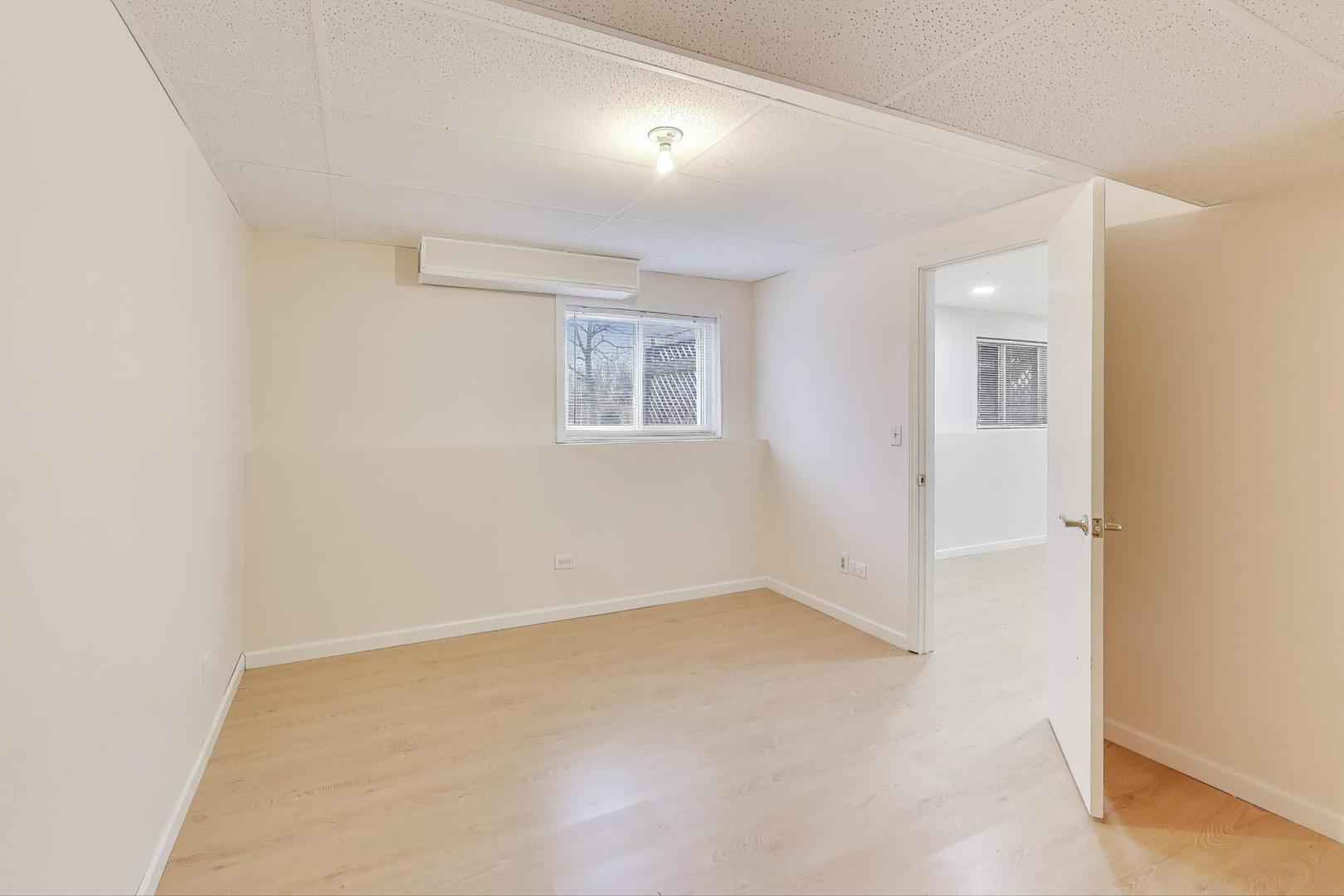 719 Sun Lake Road Lake Villa, IL 60046 - Photo 36 of 46 an empty room with a window