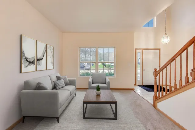 a living room with furniture and a window