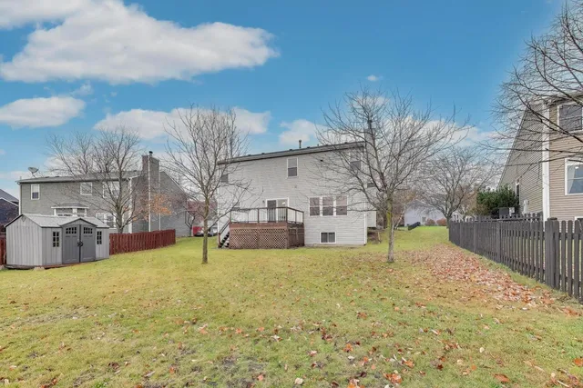 a backyard of a house with lots of green space