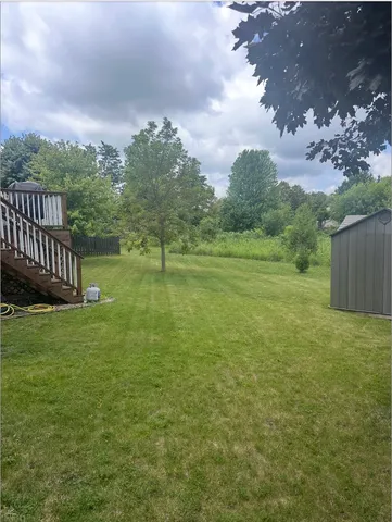 a view of a house with a big yard