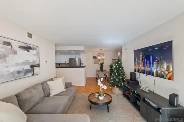 a kitchen with a refrigerator and a stove top oven