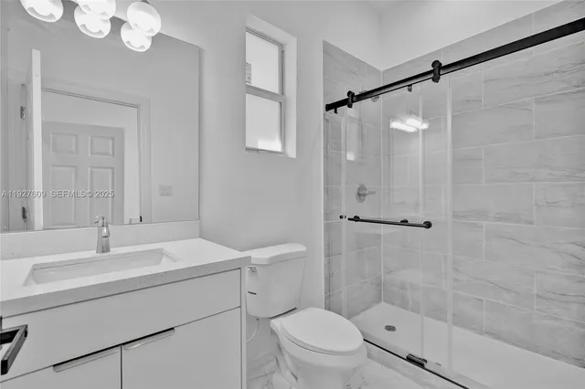 a bathroom with a sink vanity and a mirror