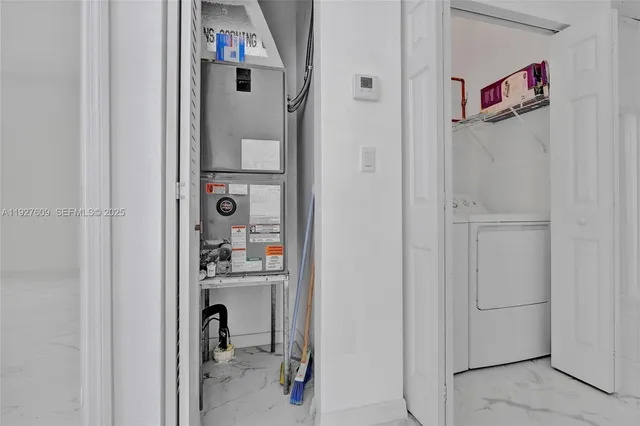 a utility room with dryer and washer