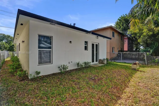 a view of a backyard with large trees