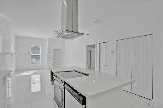 a view of a kitchen and a window