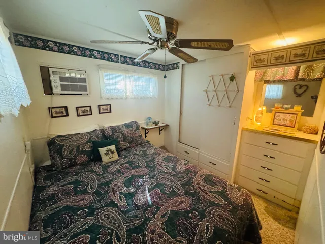 a bedroom with a bed and a mirror