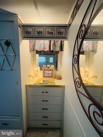 a bathroom with a mirror and a sink