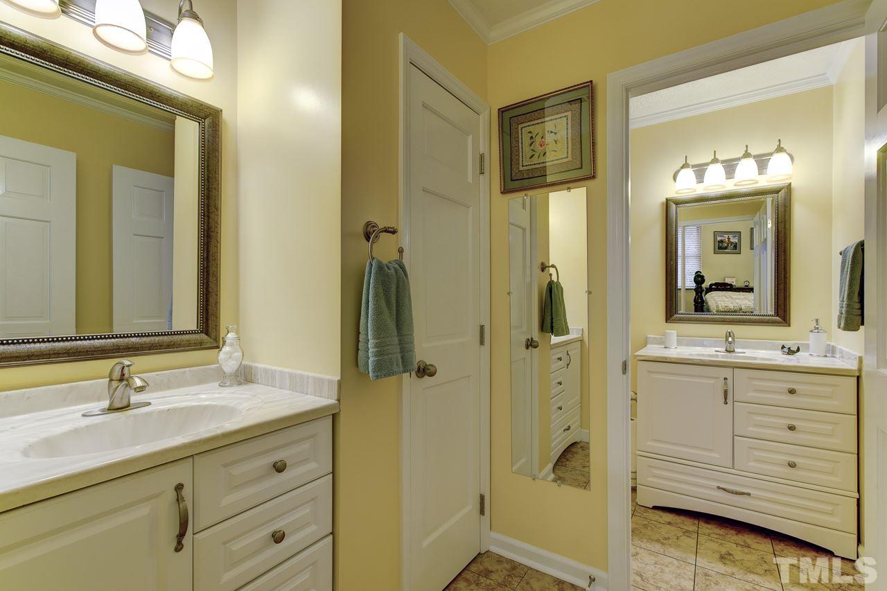 5501 Hamstead Crossing Raleigh, NC 27612 - Photo 15 of 25 a bathroom with a granite countertop sink mirror and a