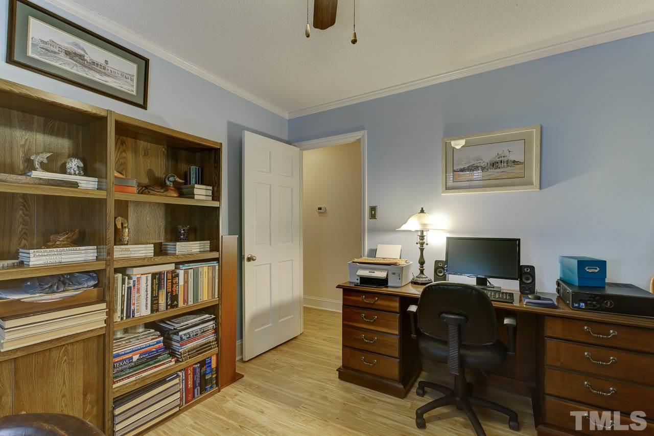 5501 Hamstead Crossing Raleigh, NC 27612 - Photo 16 of 25 a view of a workspace with furniture and a window