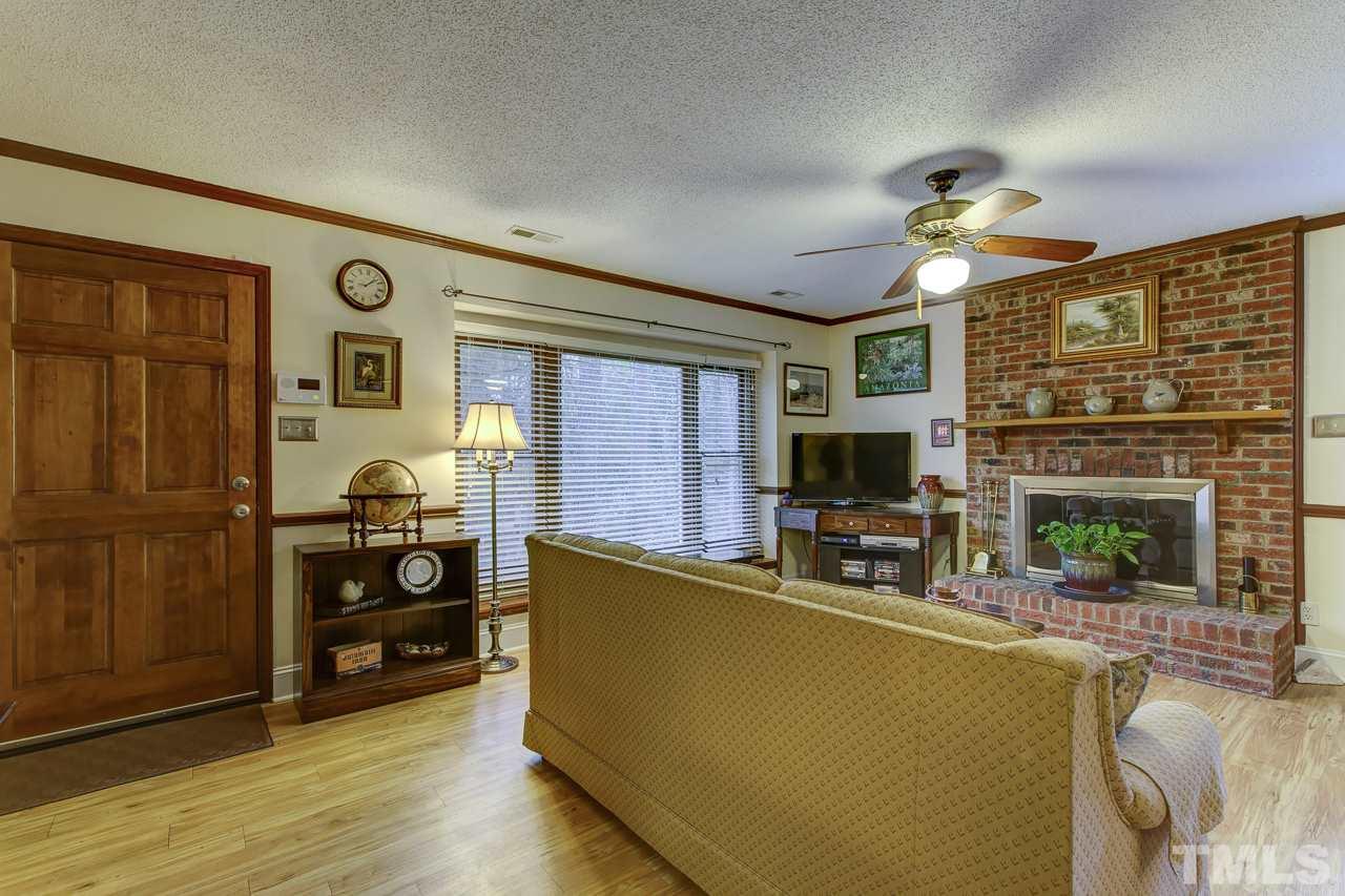 5501 Hamstead Crossing Raleigh, NC 27612 - Photo 3 of 25 a living room with furniture and wooden floor
