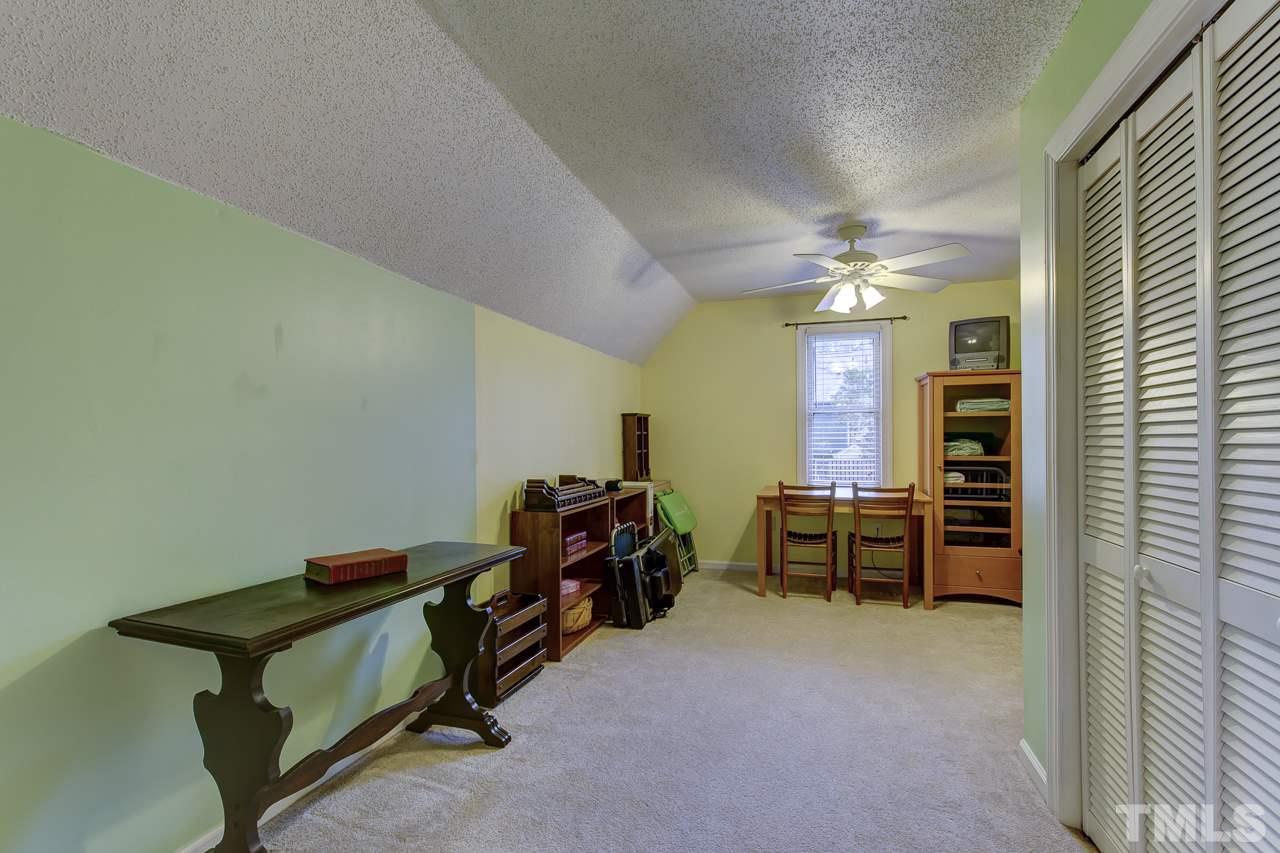 5501 Hamstead Crossing Raleigh, NC 27612 - Photo 21 of 25 a room with furniture and musical instruments