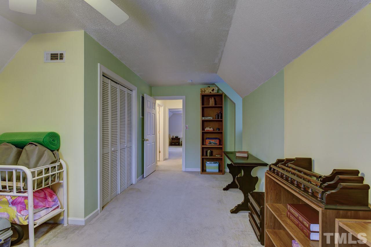 5501 Hamstead Crossing Raleigh, NC 27612 - Photo 22 of 25 a view of a room with gym equipment