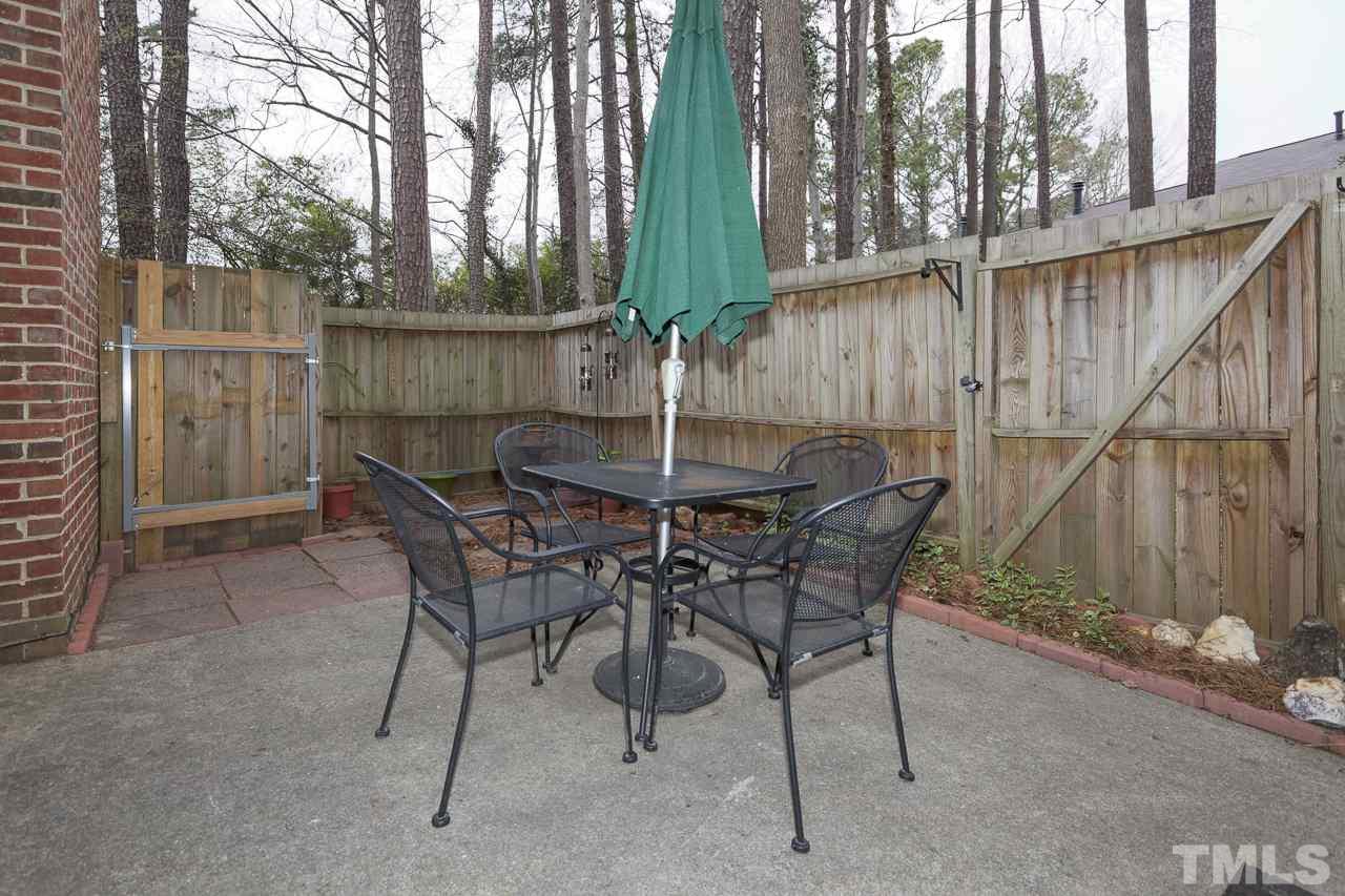 5501 Hamstead Crossing Raleigh, NC 27612 - Photo 23 of 25 a patio with table and chairs