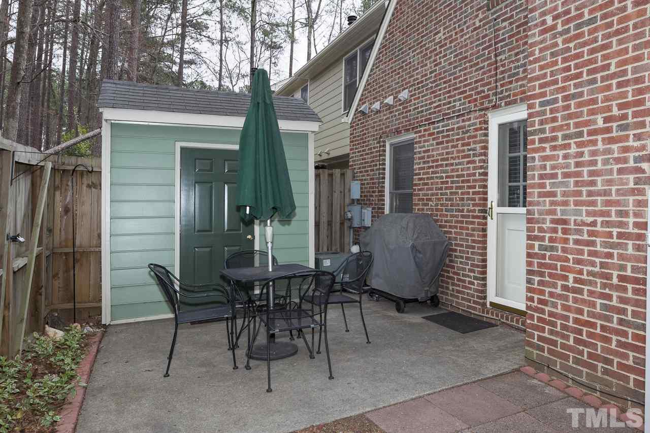 5501 Hamstead Crossing Raleigh, NC 27612 - Photo 24 of 25 a view of a patio with table and chairs and potted plants