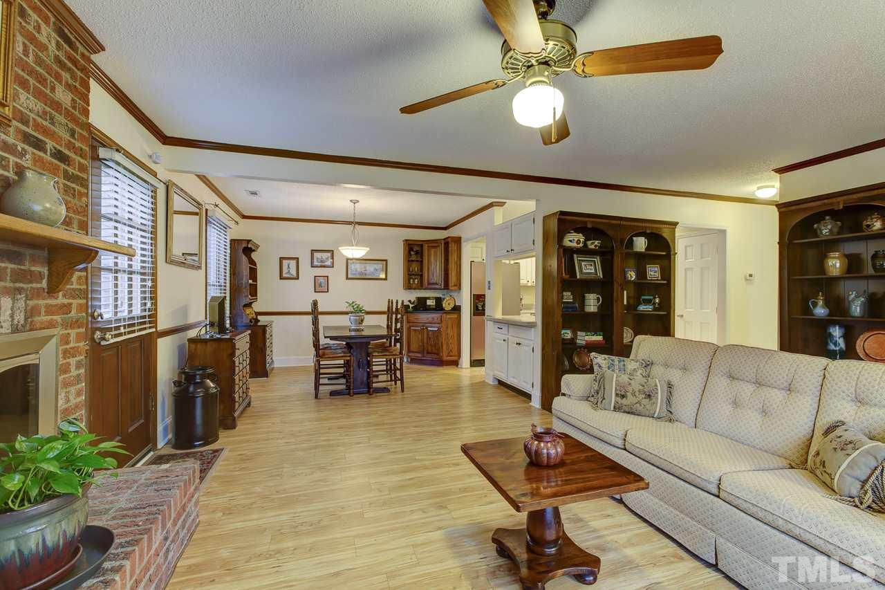 5501 Hamstead Crossing Raleigh, NC 27612 - Photo 6 of 25 a living room with furniture and wooden floor