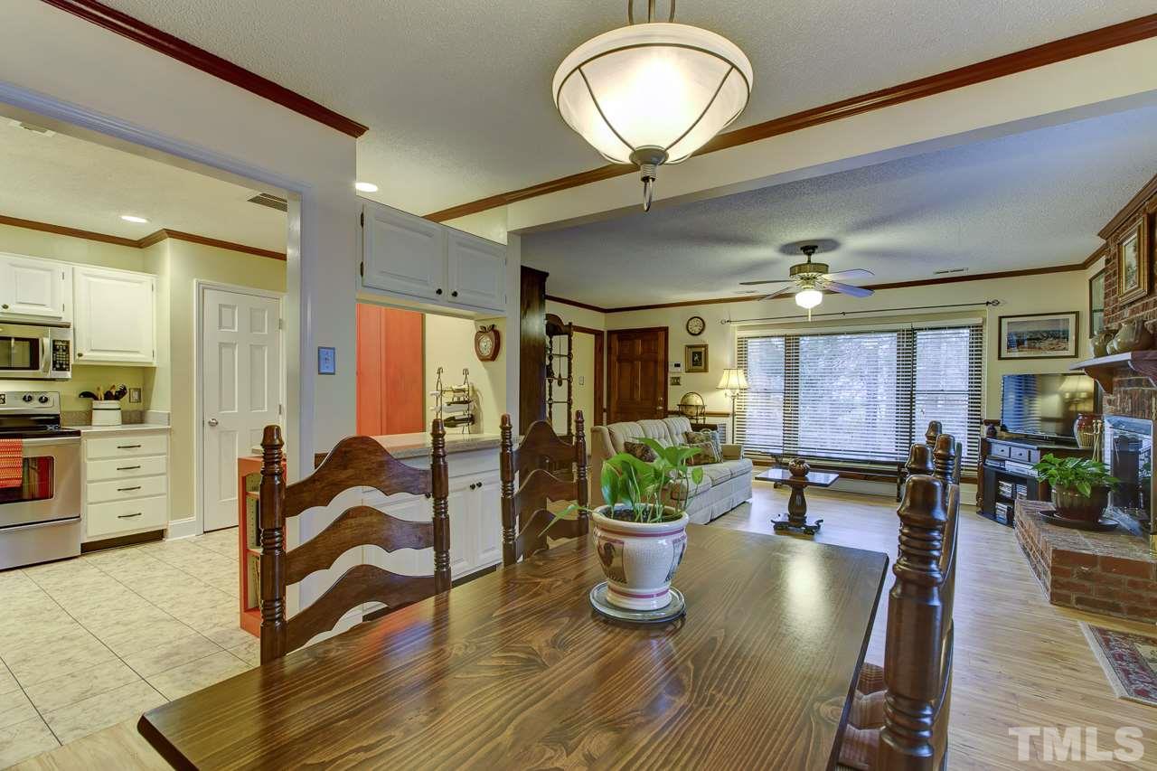 5501 Hamstead Crossing Raleigh, NC 27612 - Photo 7 of 25 a view of living room filled with furniture and potted plant