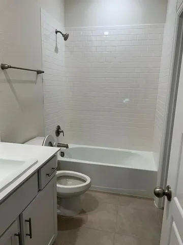 a bathroom with a sink a toilet and a bathtub