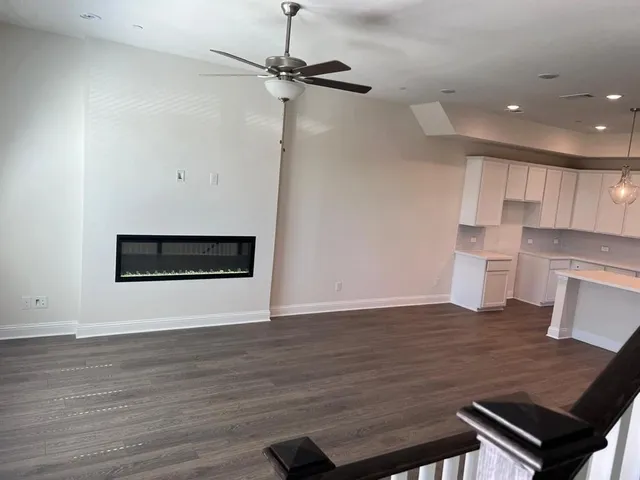 a view of kitchen with cabinets and wooden floor