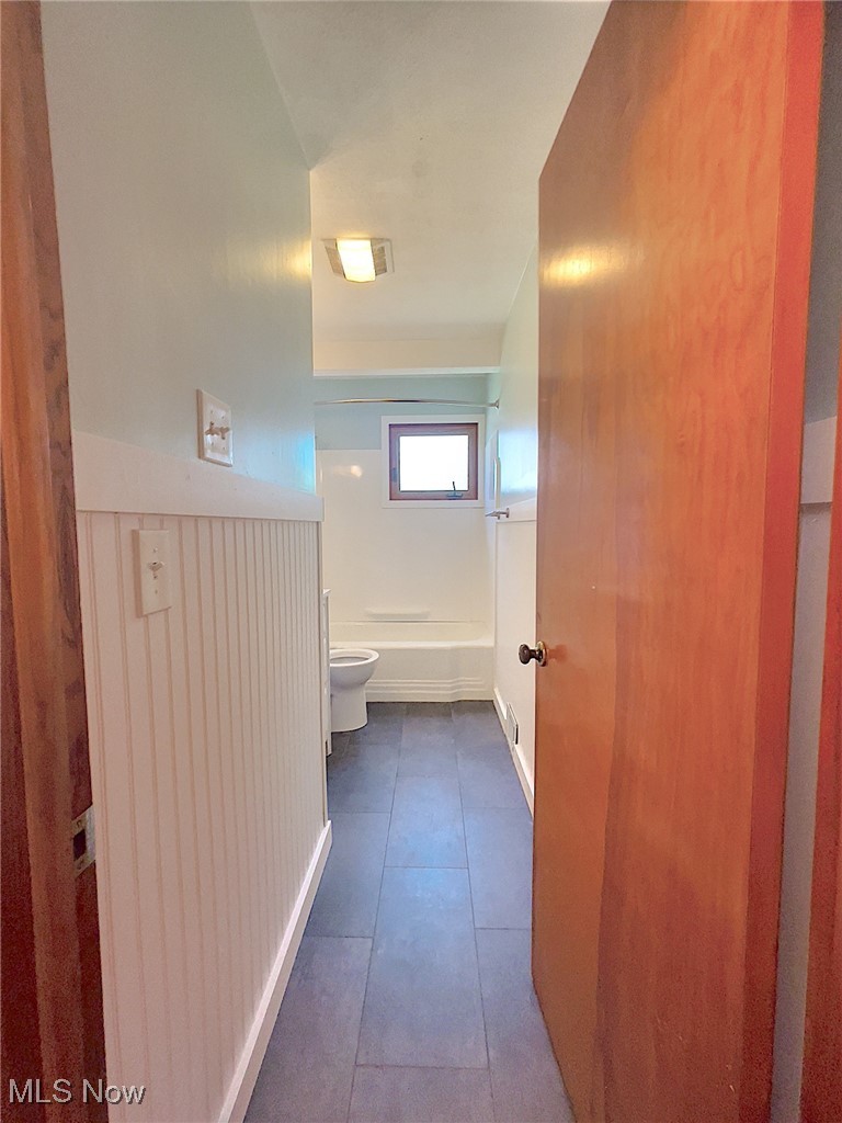 24000 Knickerbocker Road Bay Village, OH 44140 - Photo 14 of 27 Hallway featuring dark tile flooring