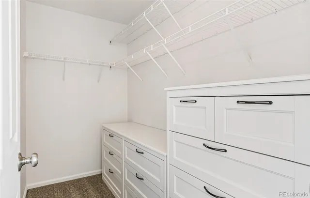 a view of an empty walk in closet