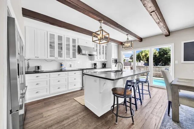 a view of a dining room with furniture and window