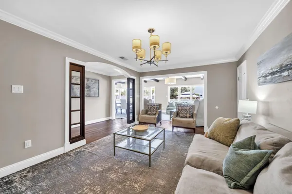 a spacious bedroom with a bed and a large window