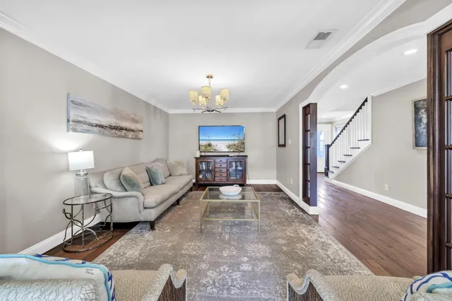 a bathroom with a granite countertop toilet a sink and a mirror