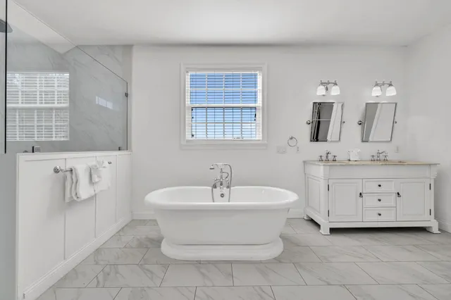 a bed room with a bed and a chandelier