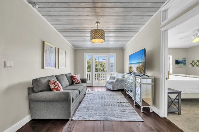 a living room with furniture and a lamp
