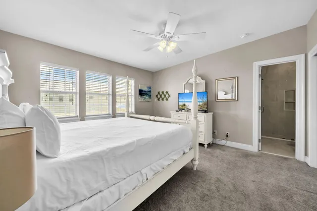 a front view of a house with a garden and porch