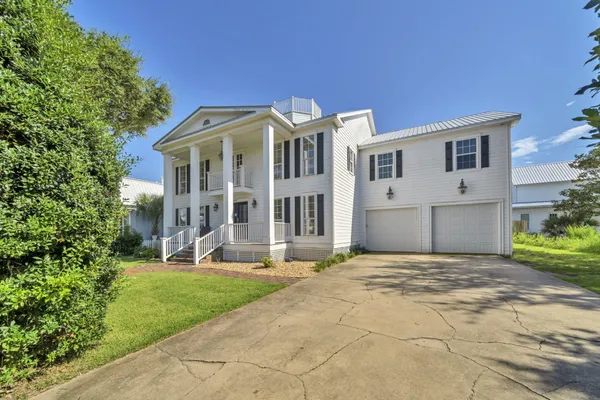 a large kitchen with stainless steel appliances granite countertop a lot of counter space and a sink