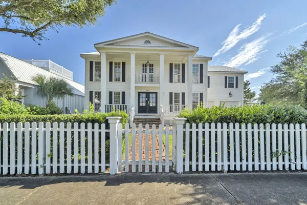 a kitchen with stainless steel appliances granite countertop a sink a stove and cabinets