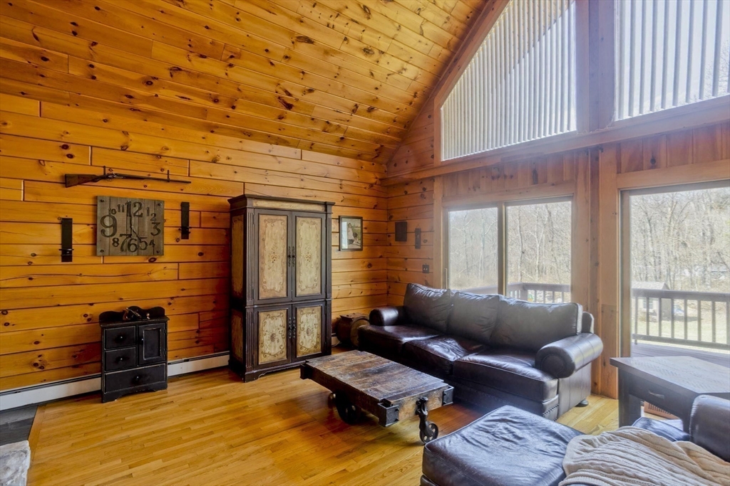2136 Baptist Hill Road Palmer, MA 01069 - Photo 17 of 41 a living room with furniture and a flat screen tv