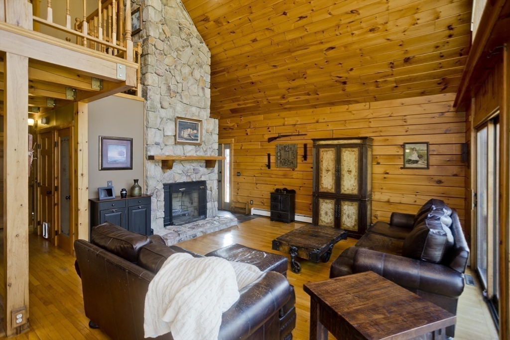 2136 Baptist Hill Road Palmer, MA 01069 - Photo 18 of 41 a living room with furniture and a fireplace