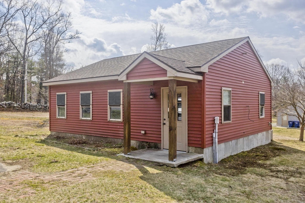 2136 Baptist Hill Road Palmer, MA 01069 - Photo 2 of 41 a front view of a house with a yard