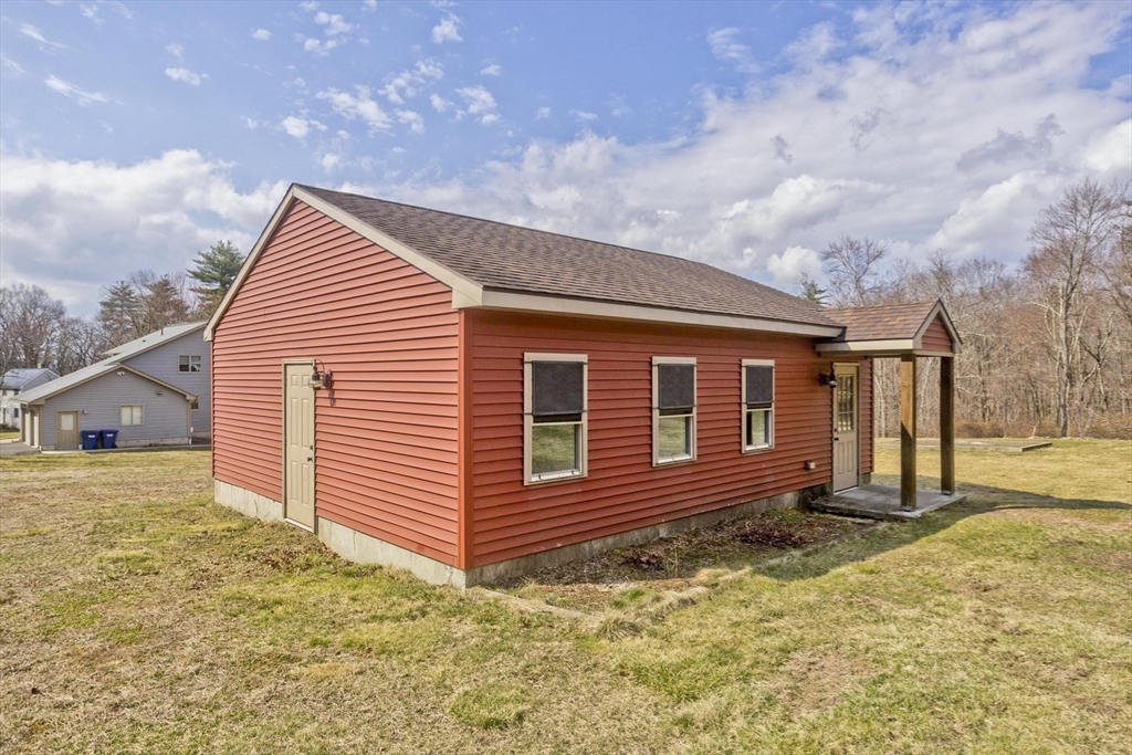 2136 Baptist Hill Road Palmer, MA 01069 - Photo 26 of 41 a view of a house with a yard