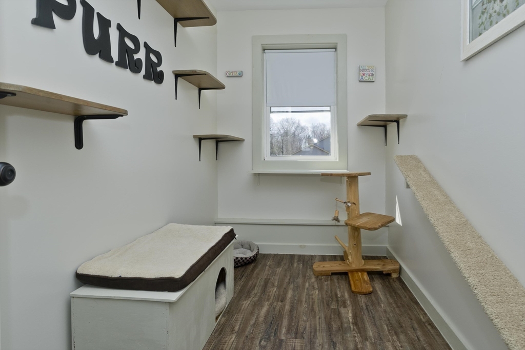 2136 Baptist Hill Road Palmer, MA 01069 - Photo 29 of 41 a room with chairs and wooden floor