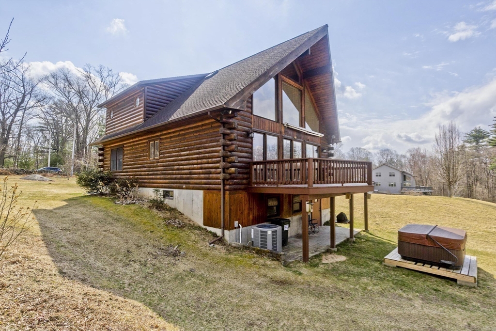 2136 Baptist Hill Road Palmer, MA 01069 - Photo 35 of 41 a view of a house with a yard and sitting area
