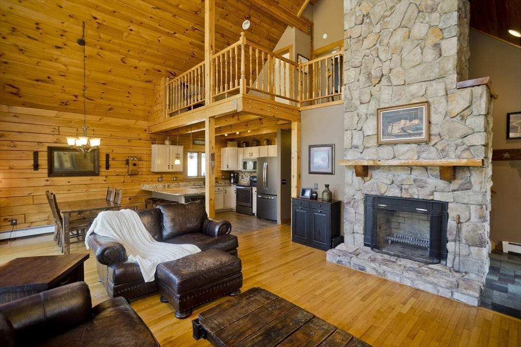 2136 Baptist Hill Road Palmer, MA 01069 - Photo 4 of 41 a view of a patio with couches chairs and a fireplace