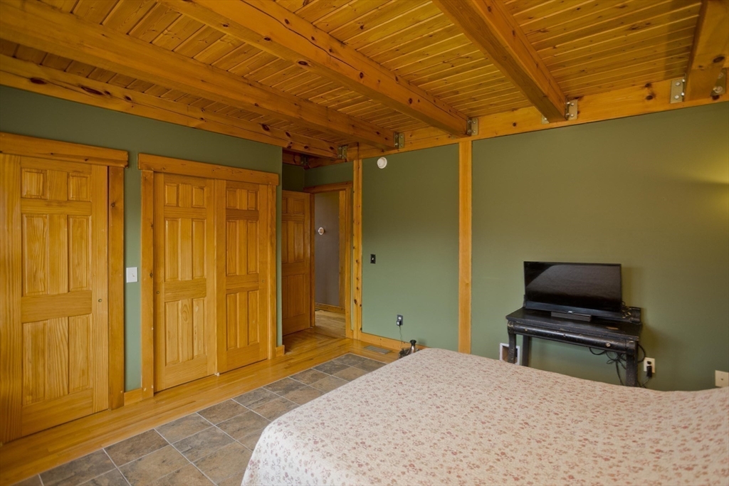 2136 Baptist Hill Road Palmer, MA 01069 - Photo 8 of 41 a bedroom with a bed and a window