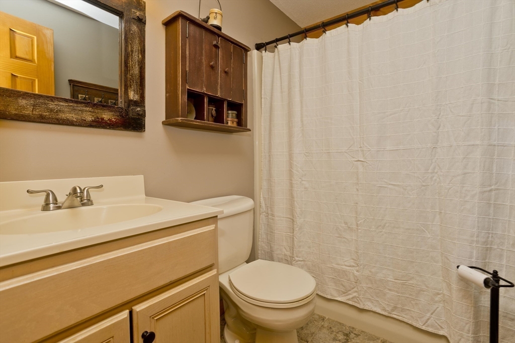 2136 Baptist Hill Road Palmer, MA 01069 - Photo 10 of 41 a bathroom with a sink a toilet and a mirror
