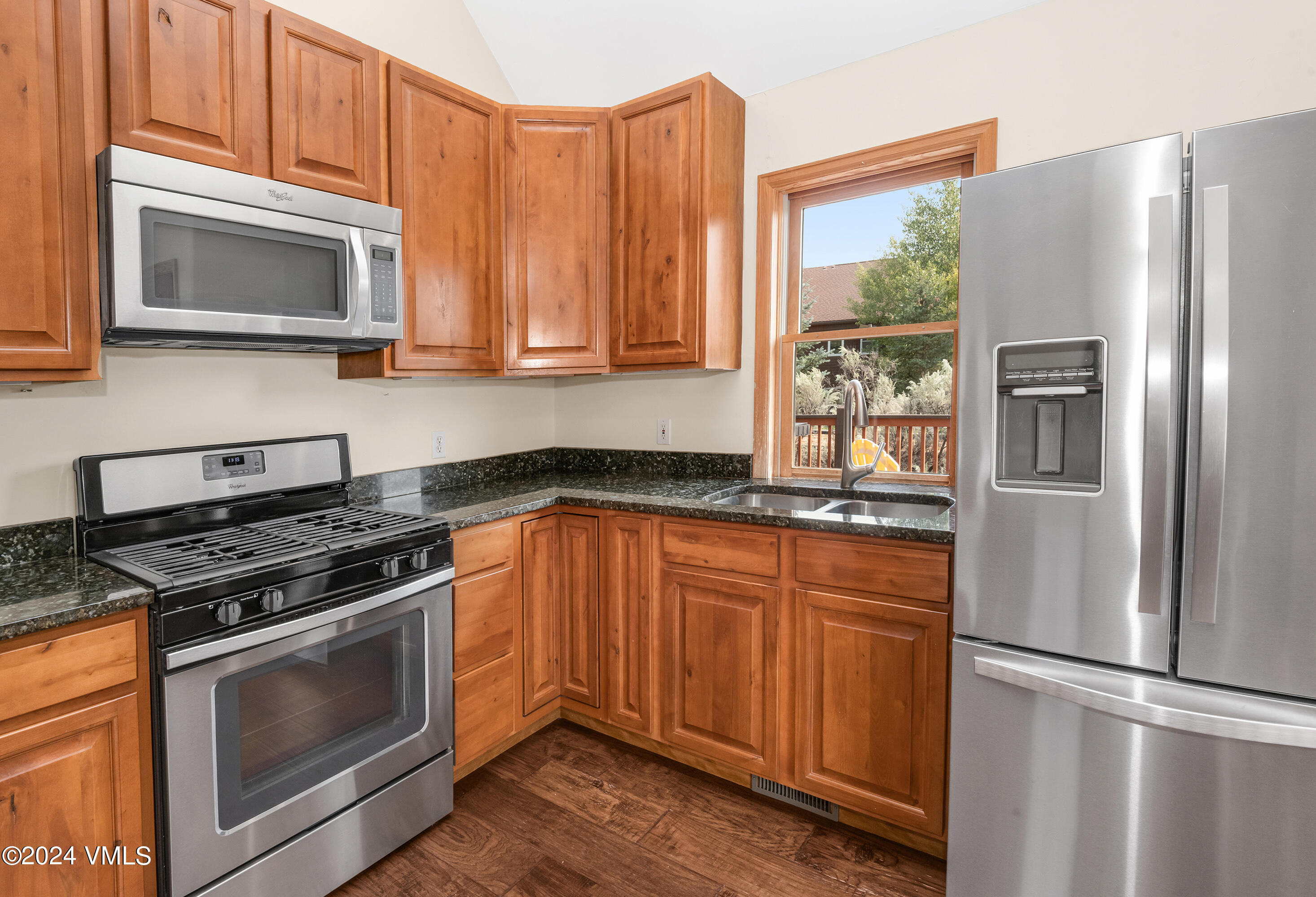 490 Neilson Gulch Road Eagle, CO 81631 - Photo 11 of 55 a kitchen with stainless steel appliances granite countertop a refrigerator stove and sink