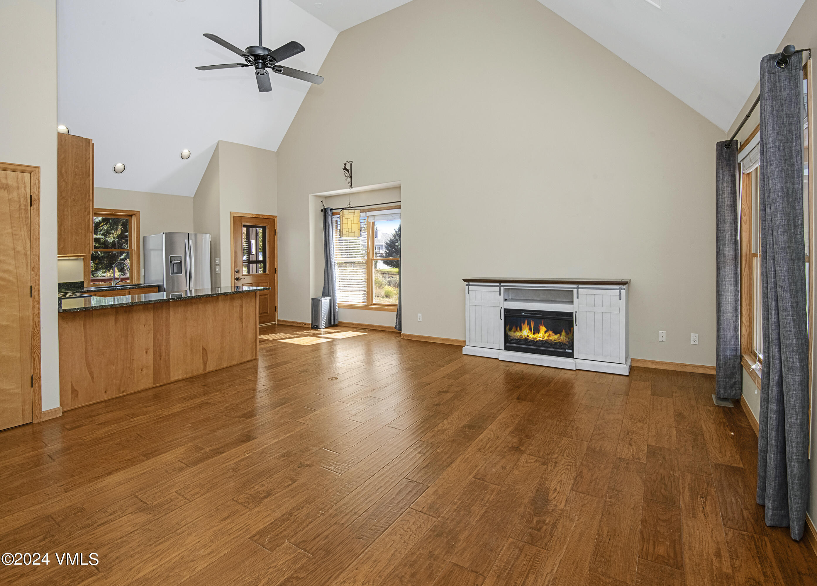 490 Neilson Gulch Road Eagle, CO 81631 - Photo 12 of 55 a view of a livingroom with wooden floor and a fireplace