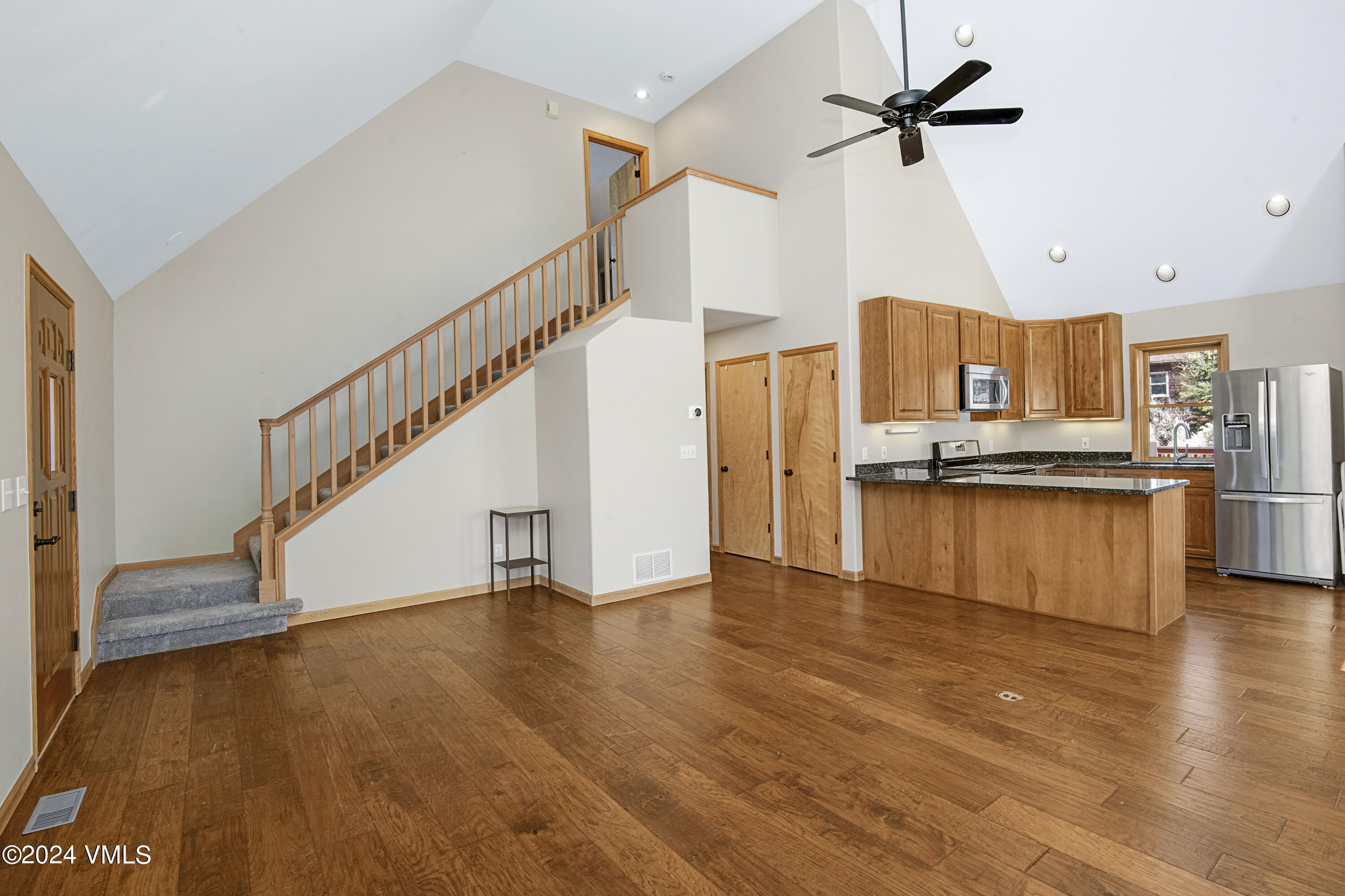 490 Neilson Gulch Road Eagle, CO 81631 - Photo 13 of 55 a view of kitchen with stainless steel appliances wooden floor and cabinets