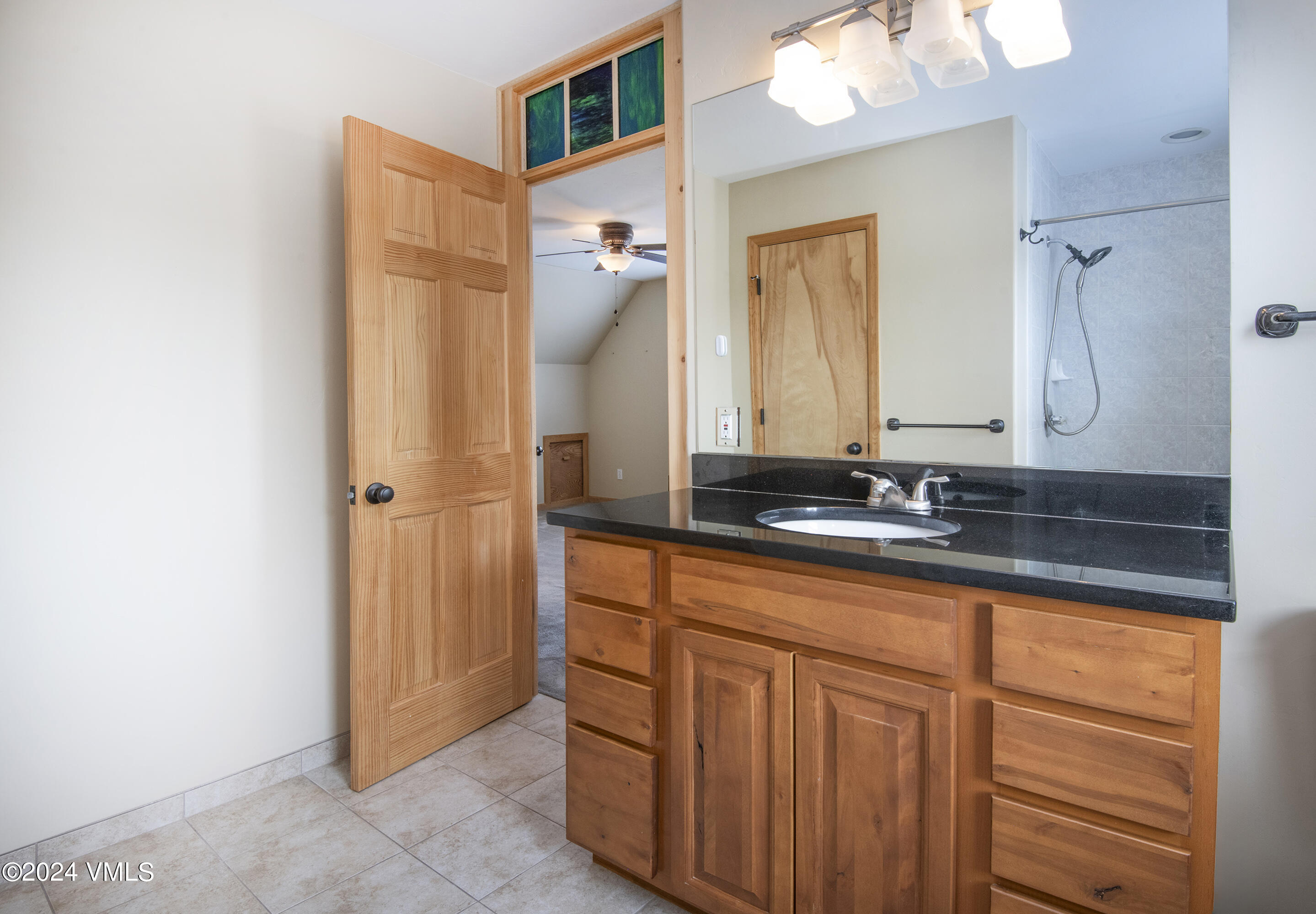 490 Neilson Gulch Road Eagle, CO 81631 - Photo 21 of 55 a bathroom with a sink and a mirror