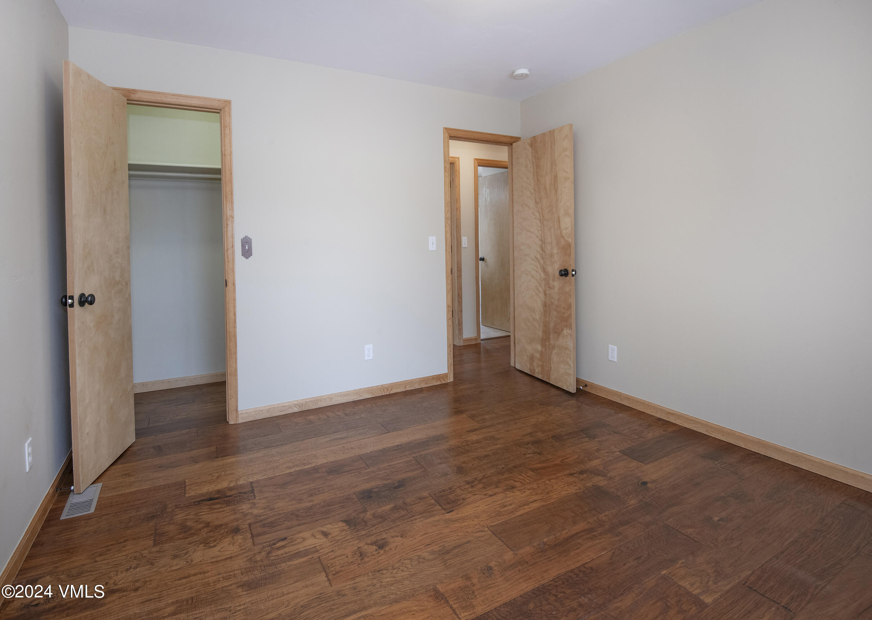 490 Neilson Gulch Road Eagle, CO 81631 - Photo 28 of 55 a view of an empty room and wooden floor