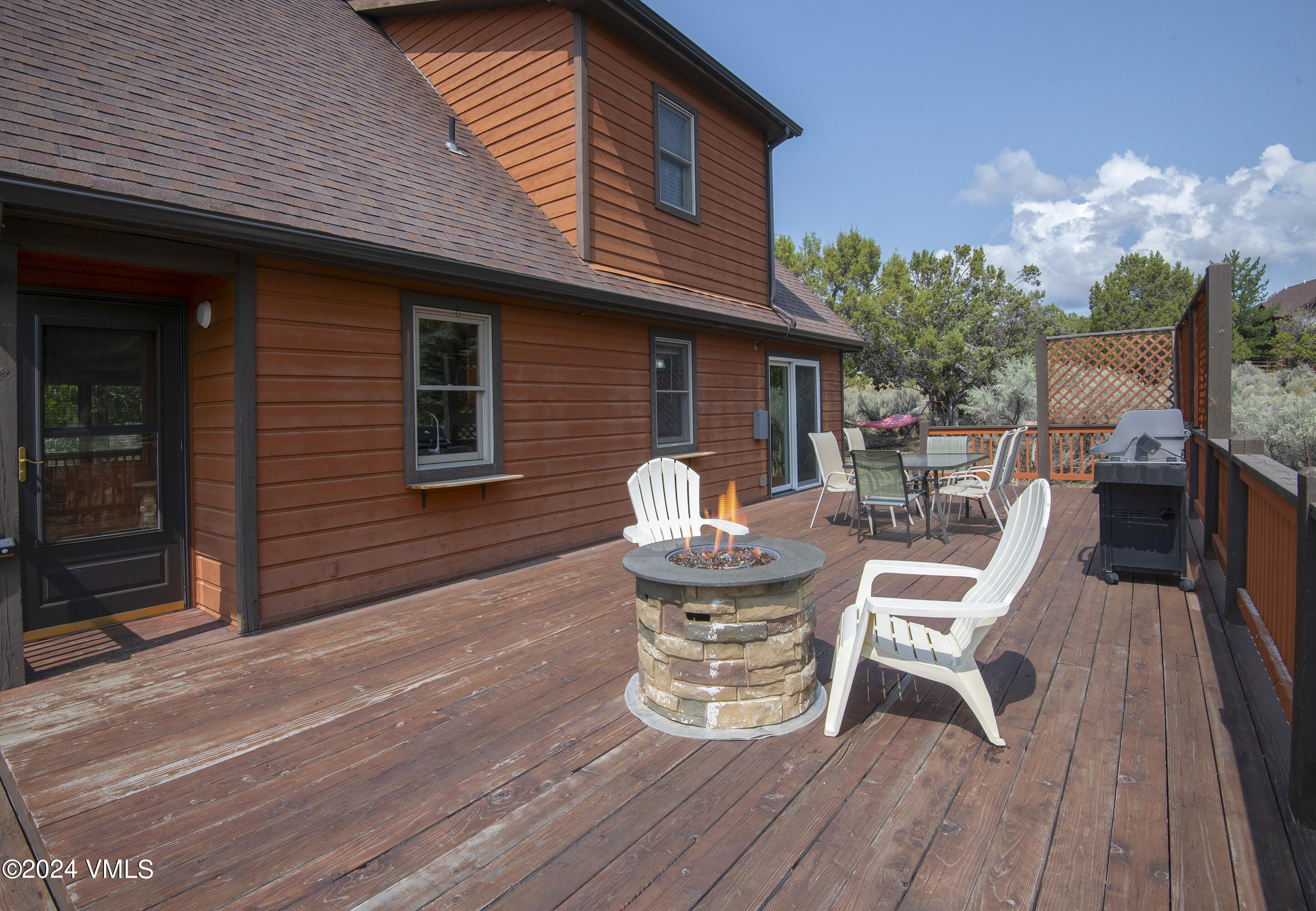 490 Neilson Gulch Road Eagle, CO 81631 - Photo 29 of 55 a table and chairs in front of a house